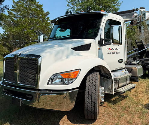 Haul-Out Maryland roll-off dumpster truck used for local dumpster delivery and pickup