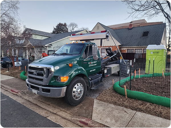 Haul-Out Maryland dumpster rental truck serving a residential property in Maryland